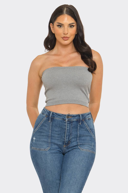 Strapless ribbed bandeau crop top in gray paired with high-waisted jeans on model.