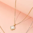 Stylish reversible quatrefoil pendant necklace close up