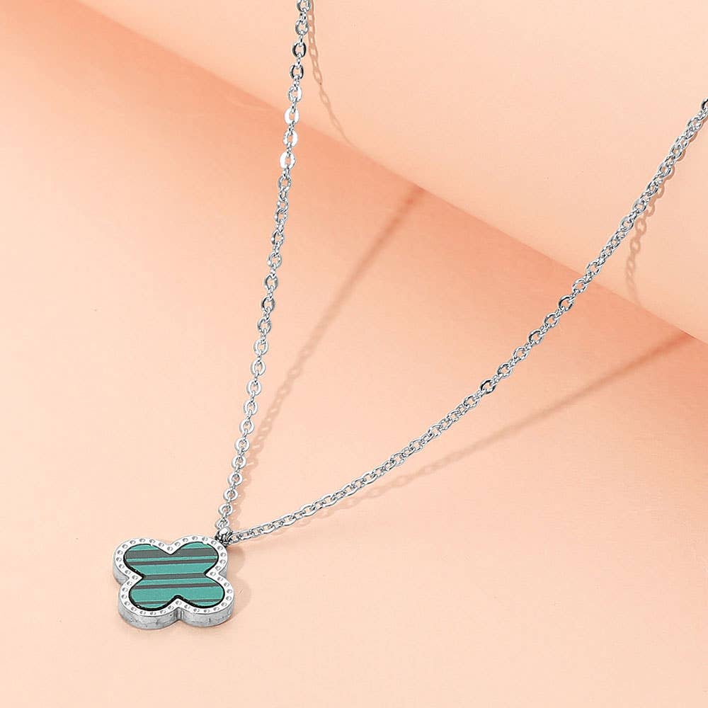 Stainless steel quatrefoil pendant necklace close up