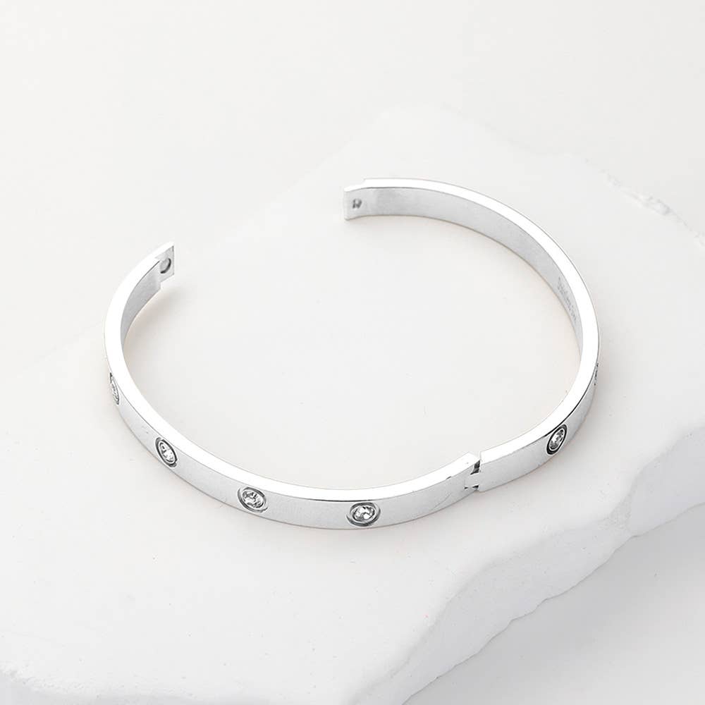 Stylish stainless steel station bangle bracelet close up
