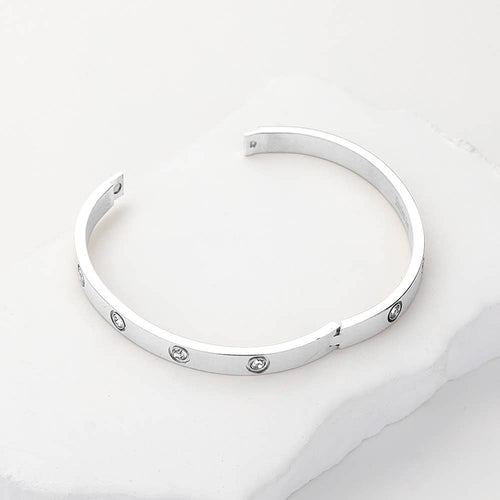Stylish stainless steel station bangle bracelet close up