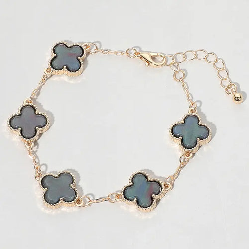 gold clover charm link bracelet for women close up product view